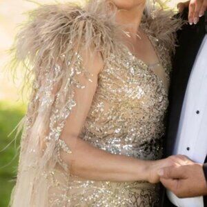 Gold feathered cape gown
